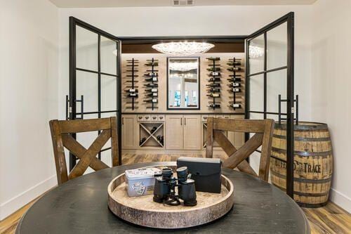 2470 Hopewell Plantation Dr, Alpharetta, GA 30004 - wine area featuring baseboards and wood finished floors