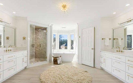 2470 Hopewell Plantation Dr, Alpharetta, GA 30004 - full bath featuring two vanities, a stall shower, a freestanding bath, ornamental molding, and recessed lighting