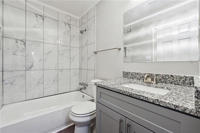 full bathroom featuring vanity, crown molding, tiled shower / bath combo, toilet, and a textured ceiling