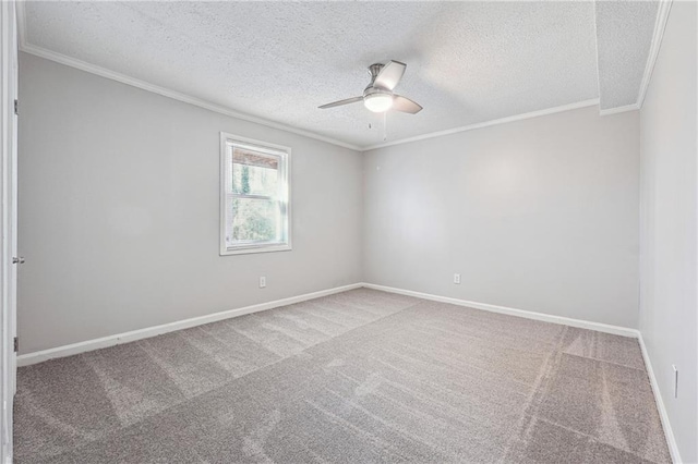 carpeted empty room with a textured ceiling, ceiling fan, and crown molding