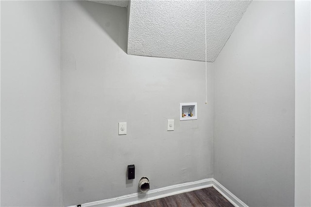 clothes washing area featuring hardwood / wood-style flooring, hookup for a washing machine, a textured ceiling, and hookup for an electric dryer