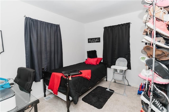 bedroom with light colored carpet