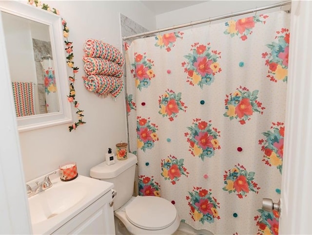 bathroom with toilet and vanity