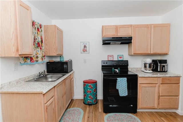 kitchen featuring black appliances, light hardwood / wood-style flooring, light brown cabinetry, and sink