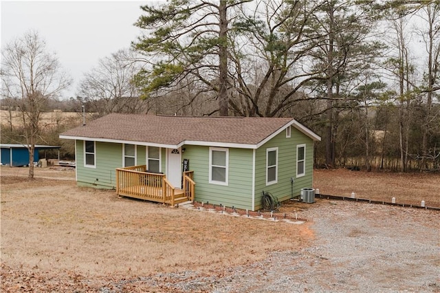 view of front of property with a deck and central AC unit