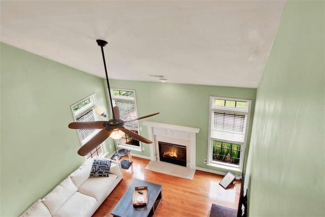 2685 Sardis Chase Ct, Buford, GA 30519 - living room with wood finished floors, a high end fireplace, a ceiling fan, and baseboards