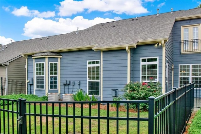 2685 Sardis Chase Ct, Buford, GA 30519 - rear view of house featuring roof with shingles and central air condition unit