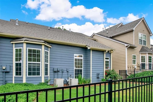 2685 Sardis Chase Ct, Buford, GA 30519 - back of property with central AC and a shingled roof