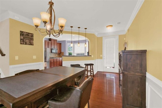 2685 Sardis Chase Ct, Buford, GA 30519 - dining room with wainscoting, a chandelier, crown molding, and dark wood finished floors