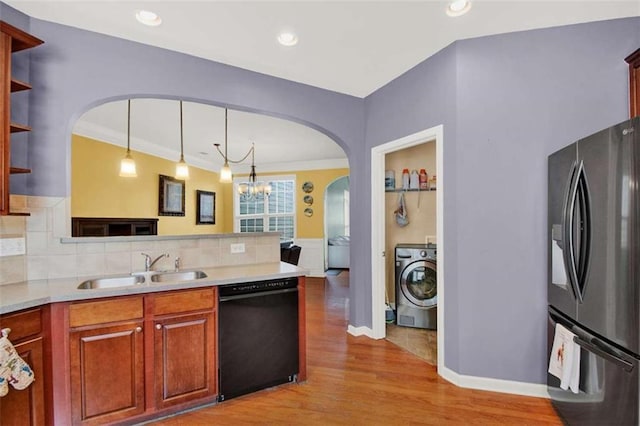 2685 Sardis Chase Ct, Buford, GA 30519 - kitchen with stainless steel refrigerator with ice dispenser, black dishwasher, washer / dryer, a sink, and arched walkways