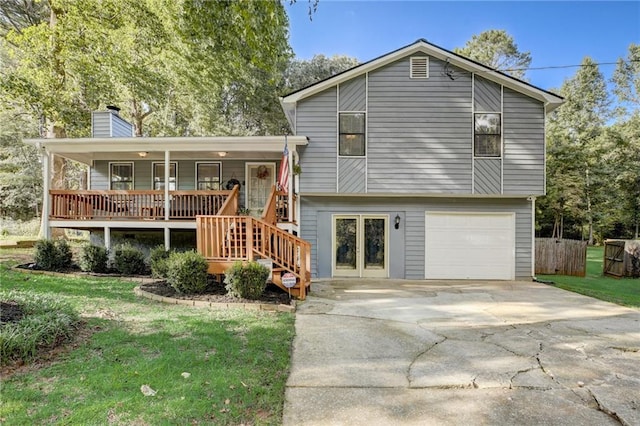 151 Quail Hollow Dr, Dallas, GA 30157 - split level home with a chimney, an attached garage, stairway, a front lawn, and covered porch