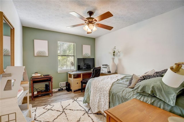 151 Quail Hollow Dr, Dallas, GA 30157 - bedroom with light wood-style flooring, a textured ceiling, and a ceiling fan