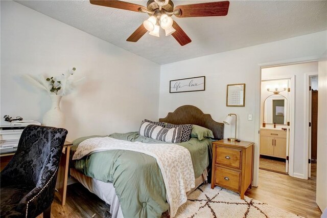 151 Quail Hollow Dr, Dallas, GA 30157 - bedroom with light wood-style floors, ceiling fan, and connected bathroom