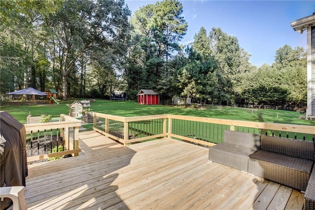 151 Quail Hollow Dr, Dallas, GA 30157 - wooden terrace with a storage shed, a lawn, and view of scattered trees