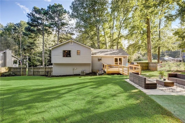 151 Quail Hollow Dr, Dallas, GA 30157 - rear view of house featuring a fenced backyard, a wooden deck, view of scattered trees, and a patio