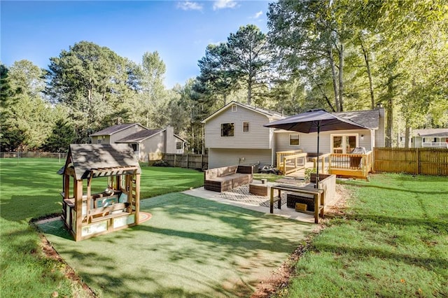 151 Quail Hollow Dr, Dallas, GA 30157 - back of property with french doors, an outdoor living space, view of wooded area, a wooden deck, and a patio area
