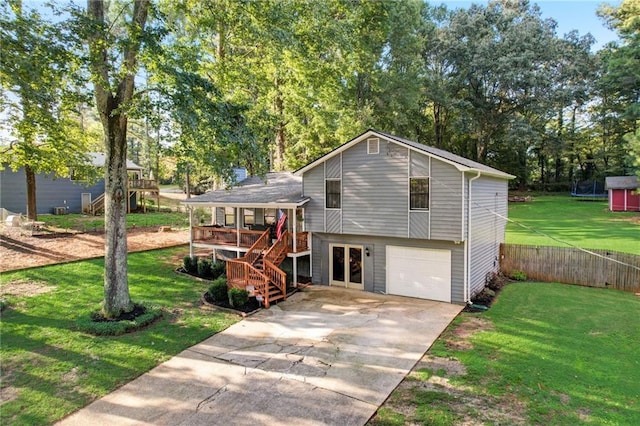 151 Quail Hollow Dr, Dallas, GA 30157 - rear view of property featuring stairway, a garage, driveway, view of scattered trees, and a porch