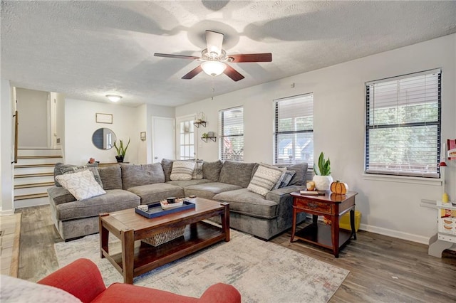 151 Quail Hollow Dr, Dallas, GA 30157 - living room with a textured ceiling, wood finished floors, ceiling fan, and stairs