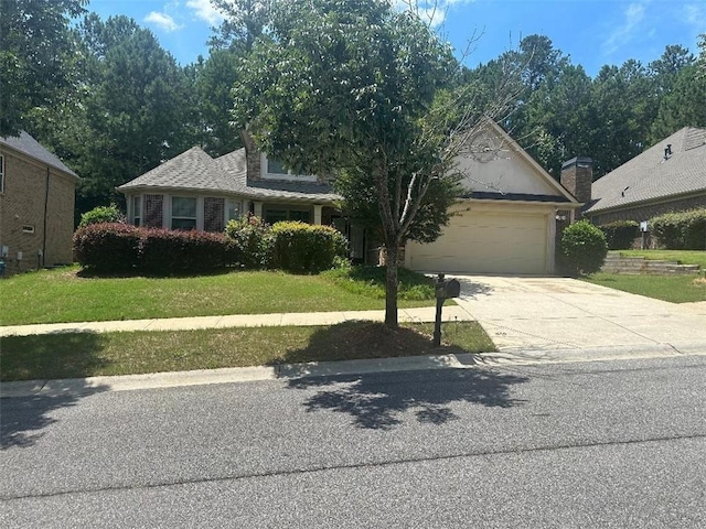 7946 Gossamer, Fairburn, GA 30213 - view of front of home featuring an attached garage, driveway, and a front yard