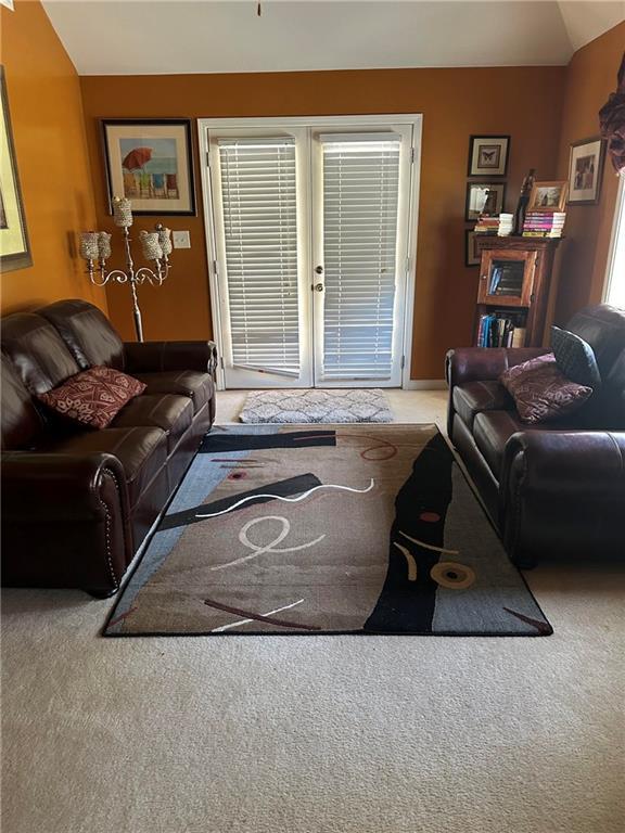 7946 Gossamer, Fairburn, GA 30213 - living area with carpet floors and french doors