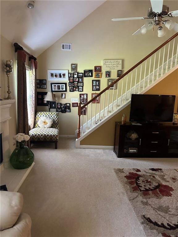 7946 Gossamer, Fairburn, GA 30213 - living room with stairs, lofted ceiling, ceiling fan, and carpet flooring