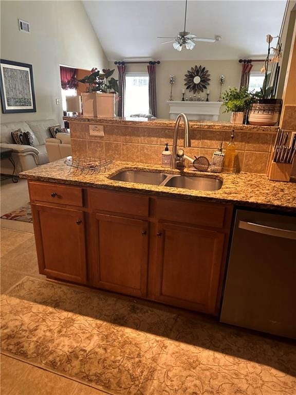 7946 Gossamer, Fairburn, GA 30213 - kitchen featuring dishwasher, light stone counters, vaulted ceiling, open floor plan, and ceiling fan