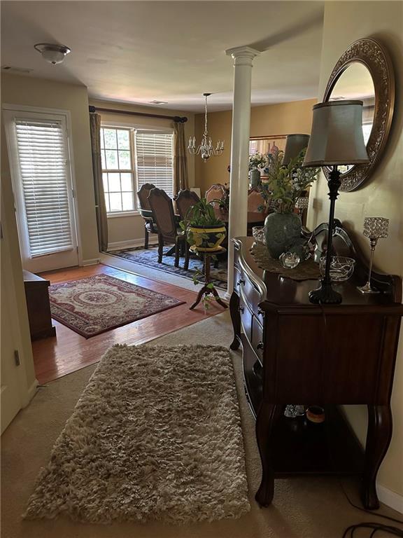7946 Gossamer, Fairburn, GA 30213 - foyer entrance featuring a chandelier and ornate columns