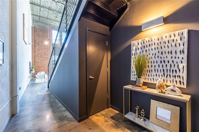 hallway with concrete flooring