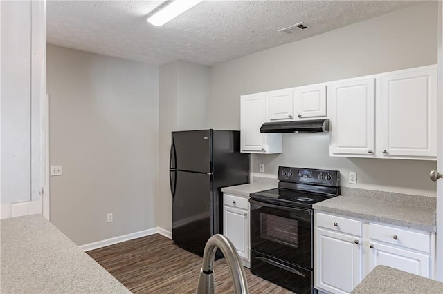 kitchen featuring a textured ceiling, white cabinets, and black appliances