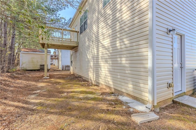 view of side of property with a deck