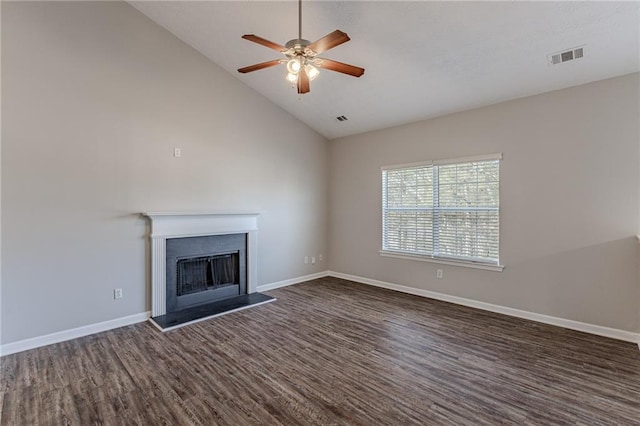 unfurnished living room with ceiling fan, dark hardwood / wood-style floors, and high vaulted ceiling