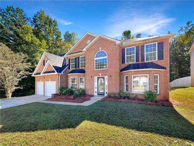 view of front of house featuring a garage and a front lawn