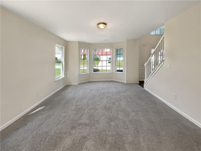 unfurnished living room with carpet flooring