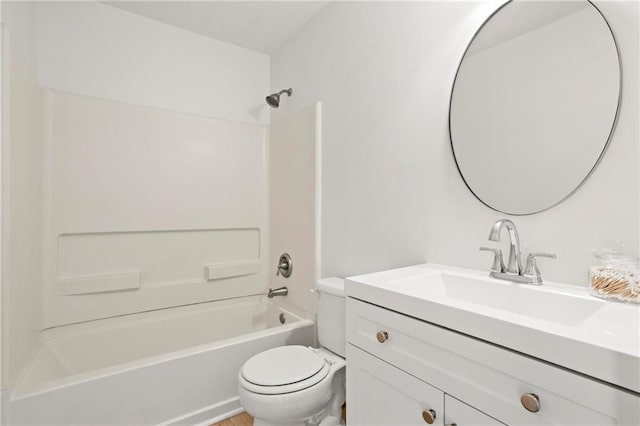 bathroom with vanity, toilet, and  shower combination