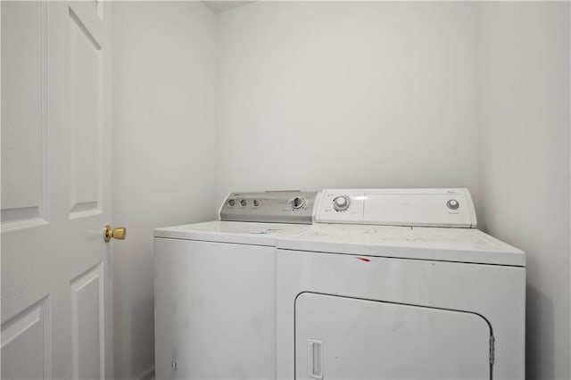 washroom featuring laundry area and washer and dryer