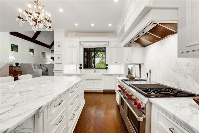 kitchen featuring pendant lighting, sink, white cabinets, custom exhaust hood, and range with two ovens