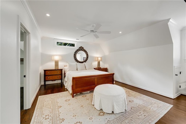 bedroom with crown molding, ceiling fan, and dark hardwood / wood-style flooring