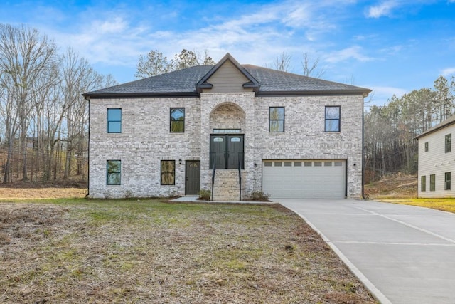 4400 Ross Estates Ct, Snellville, GA 30039 - view of front of home with a garage, driveway, brick siding, and roof with shingles