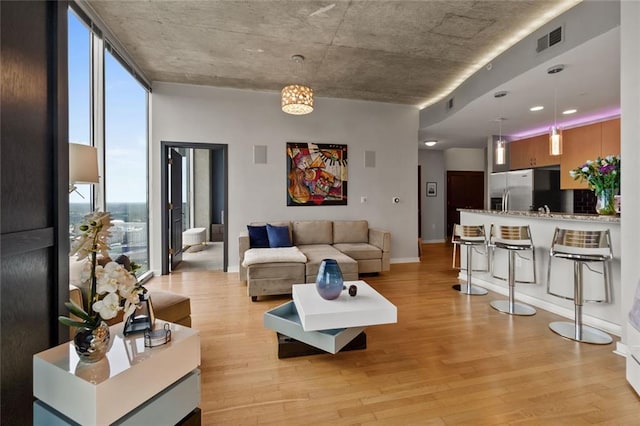 400 W Peachtree St NW Unit 3711, Atlanta, GA 30308 - living area with light wood-style floors and baseboards