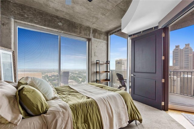 400 W Peachtree St NW Unit 3711, Atlanta, GA 30308 - bedroom with a city view and light wood-style floors