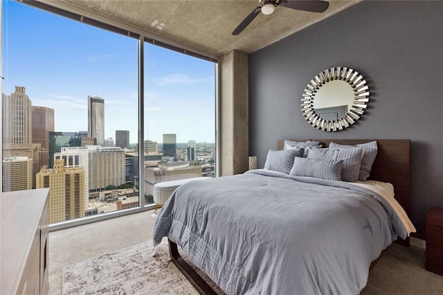 400 W Peachtree St NW Unit 3711, Atlanta, GA 30308 - bedroom featuring expansive windows, carpet, a view of city, and ceiling fan