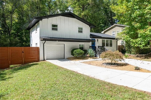 tri-level home with a front yard and a garage