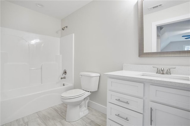 full bathroom featuring bathing tub / shower combination, vanity, and toilet