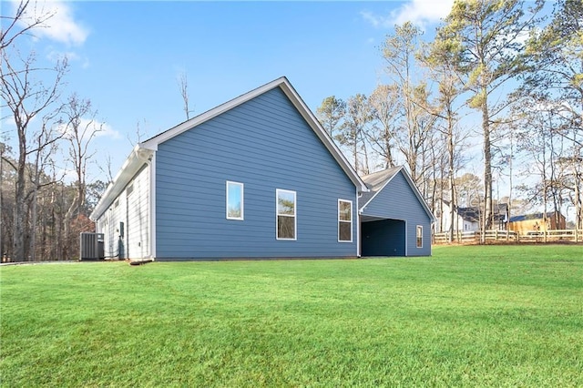 rear view of property featuring a lawn