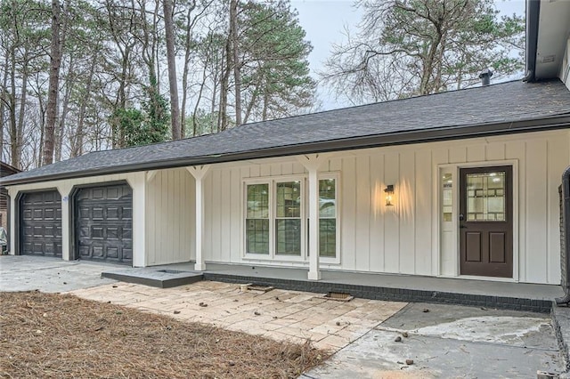 exterior space featuring a porch and a garage