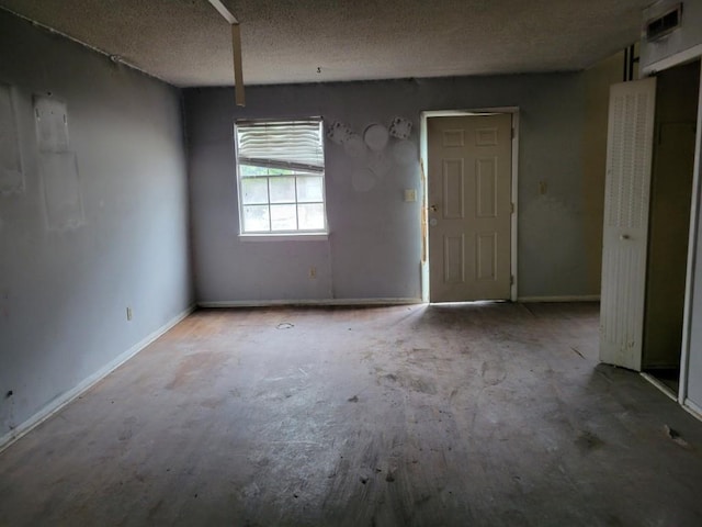 4701 Flat Shoals Rd Unit 56D, Union City, GA 30291 - unfurnished room with baseboards and a textured ceiling