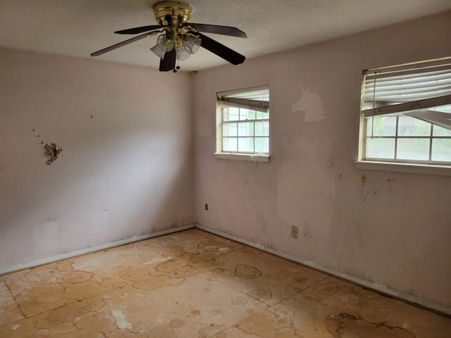 4701 Flat Shoals Rd Unit 56D, Union City, GA 30291 - spare room with a ceiling fan, a wealth of natural light, and a textured ceiling