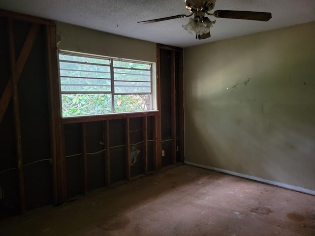 4701 Flat Shoals Rd Unit 56D, Union City, GA 30291 - spare room featuring ceiling fan, baseboards, and a textured ceiling
