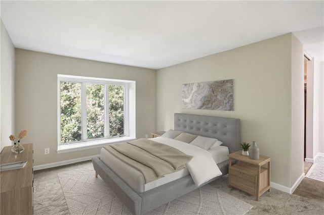 bedroom with baseboards and carpet flooring