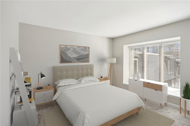 bedroom with light carpet, multiple windows, and baseboards